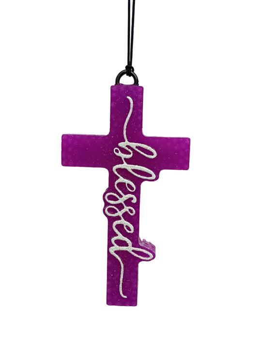 Purple cross-shaped car air freshener with 'blessed' text in white glitter