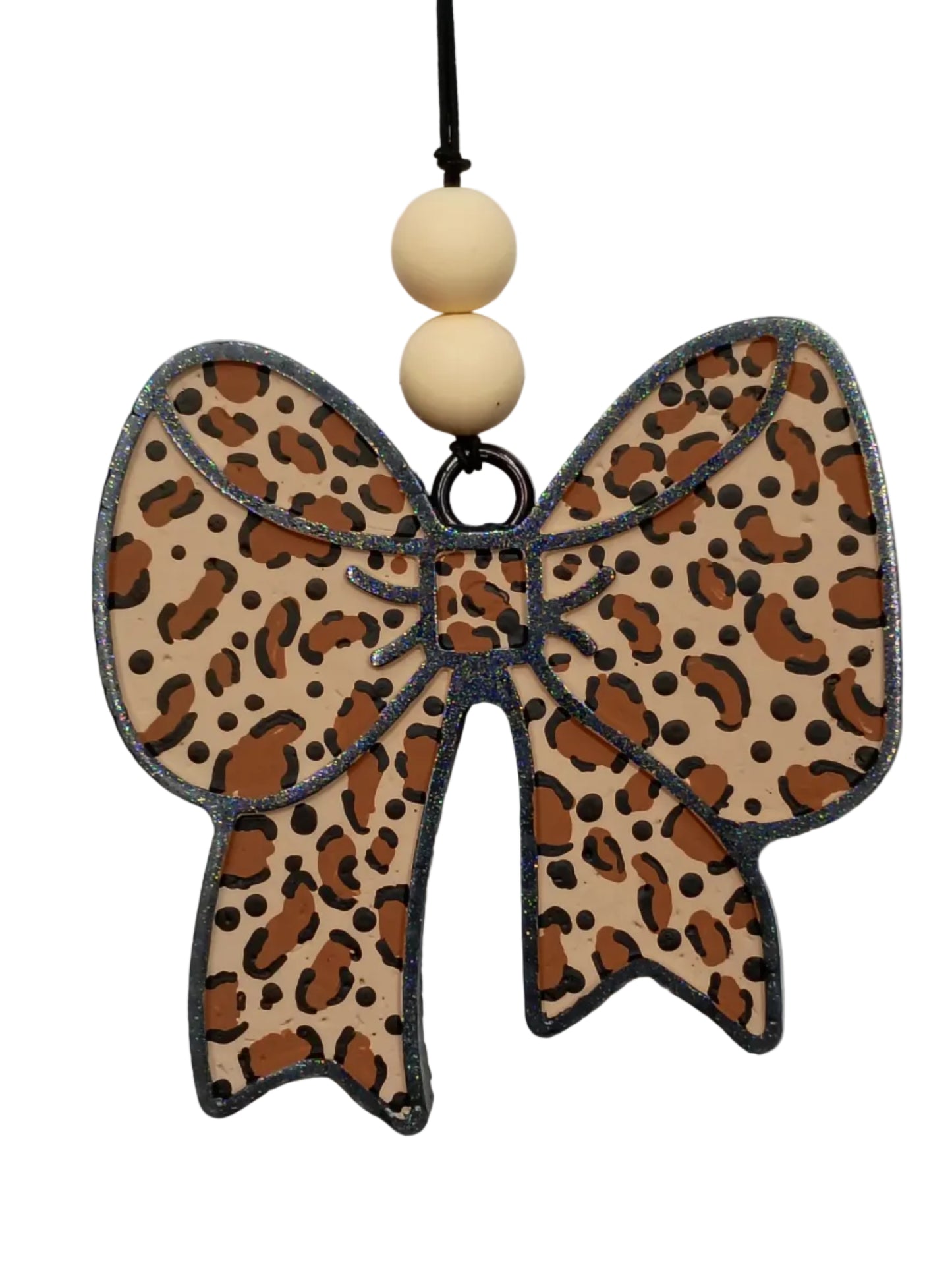 Leopard print bow-shaped air freshener with wooden beads on a light gray/black  background
